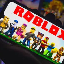 An interface displaying the Roblox home screen with various classic character avatars and the red Roblox logo on mobile screen.